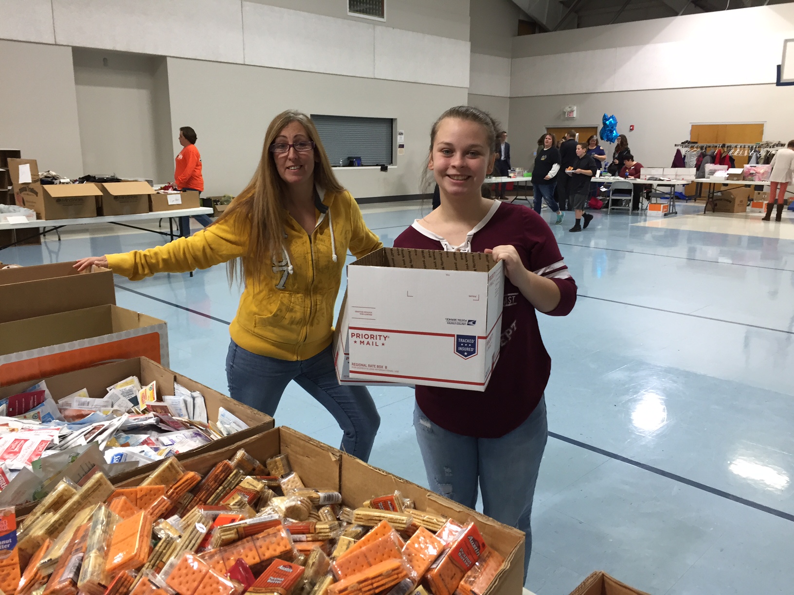 TVS CBI Students help Blue Star Moms pack food.